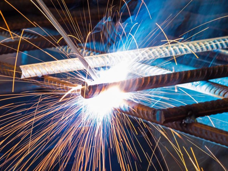 Electric welding of metal parts. Metalwork factory